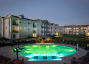 Thumbnail 25 of 37 - an outdoor swimming pool at night at an apartment complex at The Edison at Blue Springs, Blue Springs, Missouri