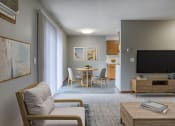Thumbnail 4 of 25 - a living room and dining area in a 555 waverly unit