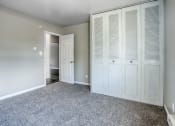 Thumbnail 10 of 22 - a bedroom with a closet and a door to a bathroom