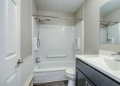 Thumbnail 14 of 22 - a bathroom with a toilet sink and bathtub
