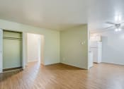 Thumbnail 8 of 22 - a living space with hardwood flooring