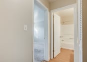 Thumbnail 13 of 22 - a bedroom with a closet and an open door