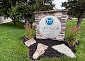 Thumbnail 21 of 21 - A sign for Highbrook townhomes with a website and phone number.