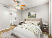 Thumbnail 43 of 56 - a bedroom with a large bed and a ceiling fan at 5636 Apartment Homes, Texas, 75254