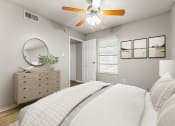 Thumbnail 40 of 56 - a bedroom with a bed and a ceiling fan at 5636 Apartment Homes, Dallas, 75254