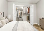 Thumbnail 39 of 56 - a bedroom with a bed and a closet full of clothes at 5636 Apartment Homes, Dallas, TX