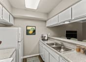 Thumbnail 23 of 56 - a kitchen wit at 5636 Apartment Homes, Dallas, Texas