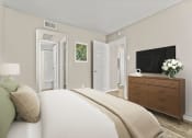 Thumbnail 28 of 56 - a bedroom with a bed and a tv at 5636 Apartment Homes, Texas, 75254