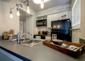 Thumbnail 22 of 26 - Kitchen With Refrigrator at The Hamptons, Texas