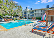 Thumbnail 7 of 15 - our apartments have a resort style pool with lounge chairs at Peaks at Northwest Hills Apartments, Austin, 78731