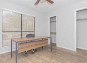 Thumbnail 44 of 68 - a room with a desk and a large window and a door to a closet at The Escapade, Texas