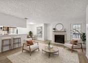 Thumbnail 1 of 43 - A living room with a fireplace, two chairs, and a coffee table.