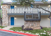 Thumbnail 37 of 68 - a stone building with a balcony and a blue door at The Escapade, San Antonio, TX