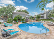 Thumbnail 30 of 68 - a swimming pool with chairs and a house in the background stock photography at The Escapade, San Antonio, 78216