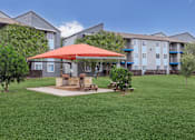 Thumbnail 26 of 63 - our apartments have a large yard with a picnic table and umbrella at The Keller, San Antonio Texas  