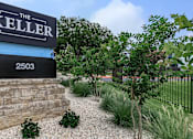 Thumbnail 32 of 63 - the sign for the restaurant is on the side of a rock retaining wall at The Keller, San Antonio  