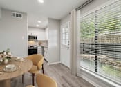 Thumbnail 2 of 68 - a breakfast nook with a large window and a table and chairs at The Escapade, San Antonio, Texas