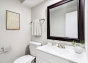Thumbnail 6 of 68 - a bathroom with a mirror and a toilet and a sink at The Escapade, San Antonio, Texas