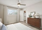 Thumbnail 13 of 68 - a bedroom with a ceiling fan and a dresser at The Escapade, San Antonio, 78216