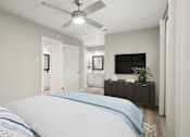 Thumbnail 9 of 68 - a bedroom with a large bed and a ceiling fan at The Escapade, San Antonio, Texas