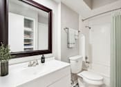 Thumbnail 11 of 68 - a bathroom with a toilet and a sink and a mirror at The Escapade, San Antonio, 78216