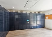 Thumbnail 12 of 60 - a row of lockers in a room with a wooden floor at Maxwell Townhomes, San Antonio, TX