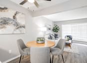 Thumbnail 2 of 41 - our apartments offer a dining room and living room with a large window at Aero White Rock, Dallas, TX