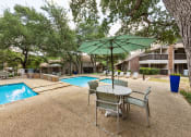 Thumbnail 43 of 47 - our apartments have a pool and a patio with a table and chairs
