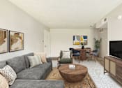 Thumbnail 12 of 26 - Living room with couch and tv at The Hamptons, Dallas, Texas
