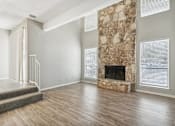Thumbnail 57 of 68 - the living room has a large stone fireplace and hardwood floors at The Escapade, San Antonio