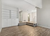 Thumbnail 62 of 68 - a living room with white walls and wood flooring and a staircase at The Escapade, San Antonio, 78216