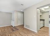 Thumbnail 65 of 68 - a kitchen and living room with a hard wood floor at The Escapade, San Antonio, TX