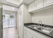 Thumbnail 60 of 68 - a kitchen with white cabinets and a sink and a window at The Escapade, San Antonio, Texas