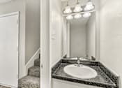 Thumbnail 61 of 68 - a bathroom with a sink and a mirror and a staircase at The Escapade, San Antonio, 78216