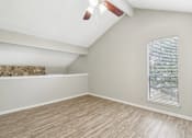 Thumbnail 66 of 68 - a bedroom with a large window and wood flooring at The Escapade, San Antonio