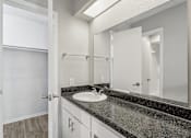 Thumbnail 58 of 68 - the ensuite bathroom of our A7 apartment at The Escapade with sink and mirror at The Escapade, San Antonio, 78216