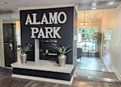 Thumbnail 5 of 20 - A sign that says Alamo Park is on a black background.