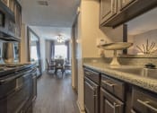 Thumbnail 17 of 28 - Kitchen at Century Park, Dallas, TX, 75254