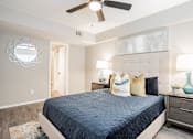 Thumbnail 10 of 41 - a bedroom with a bed and a ceiling fan at Aero White Rock, Dallas, 75238