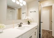 Thumbnail 12 of 41 - a bathroom with a sink and a mirror at Aero White Rock, Dallas, TX, 75238