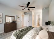 Thumbnail 23 of 54 - a bedroom with a large bed and a ceiling fan at The Frederick, Texas, 78240