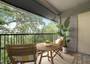 Thumbnail 26 of 54 - a patio with a table and chairs on a balcony at The Frederick, San Antonio, 78240