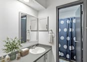 Thumbnail 28 of 45 - a bathroom with a sink and a mirror at Tradewinds, Texas, 78239