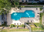 Thumbnail 14 of 54 - a house with a swimming pool in the middle of a grassy area at The Frederick, San Antonio, TX 78240