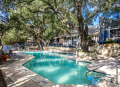 Thumbnail 16 of 54 - a swimming pool with a house in the background at The Frederick, San Antonio, 78240