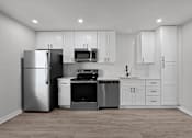 Thumbnail 75 of 79 - a white kitchen with stainless steel appliances and white cabinets at Sunset Heights, San Antonio, 78209
