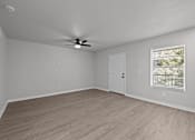 Thumbnail 69 of 79 - an empty living room with a ceiling fan and a window at Sunset Heights, San Antonio, 78209