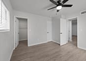 Thumbnail 76 of 79 - the living room of an empty house with a ceiling fan at Sunset Heights, Texas, 78209