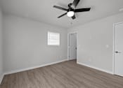 Thumbnail 79 of 79 - Photo of renovated bedroom with ceiling fan and vinyl flooring at Sunset Heights, San Antonio