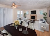 Thumbnail 41 of 45 - a living room and dining room with a table and chairs at Tradewinds, Windcrest, Texas
